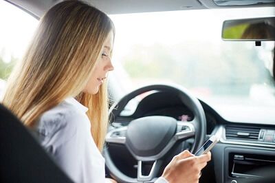 Person using a cell phone while driving 
